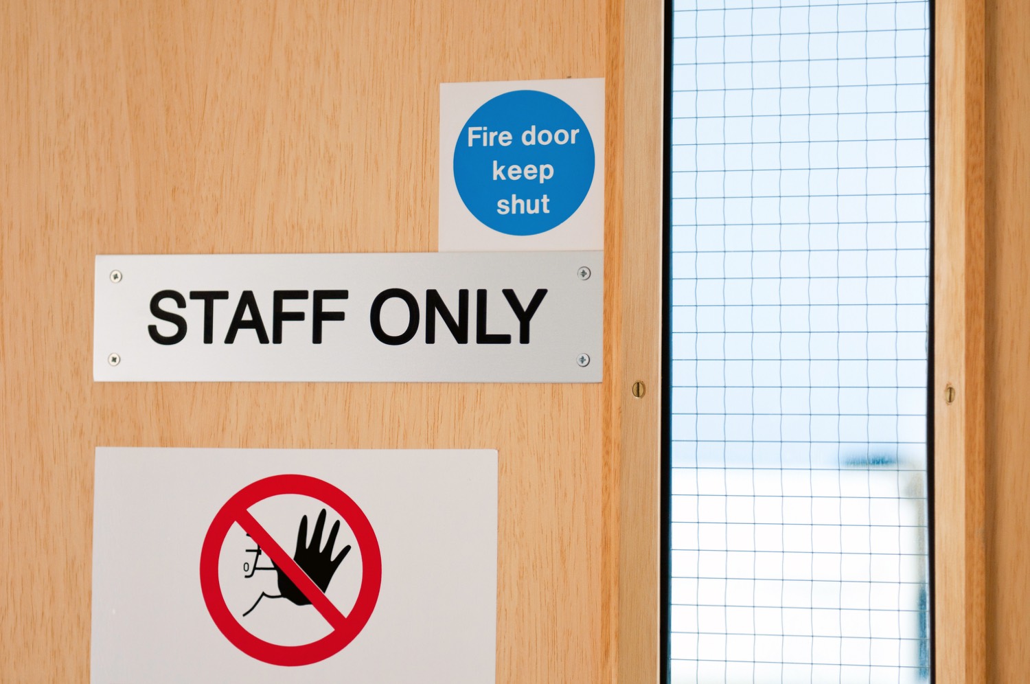 Fire door signage checked during a Bolton fire door inspection